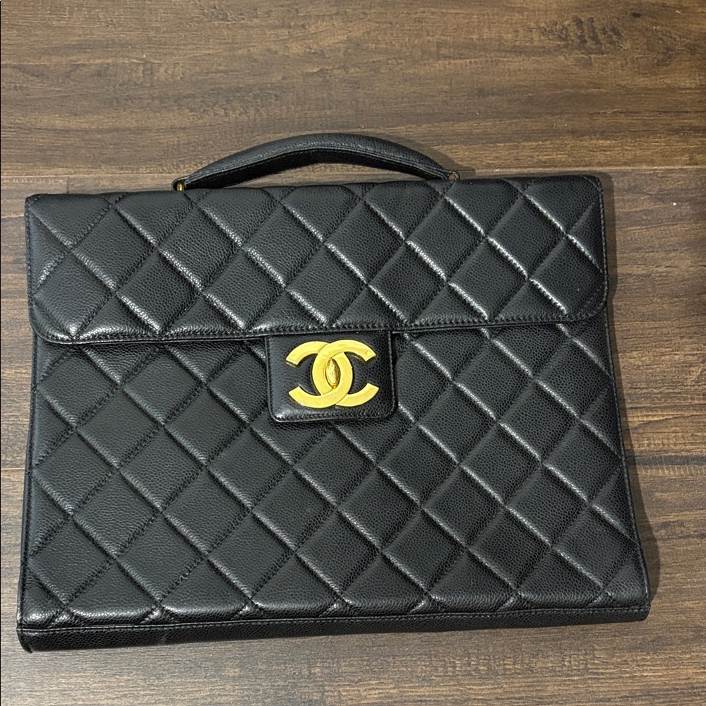 CHANEL Black Quilted Leather Bag with Gold Logo